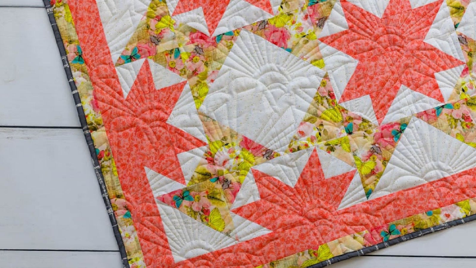 Colorful quilt with floral patterns.
