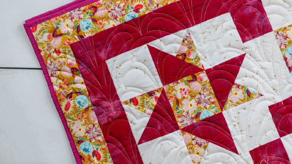 Classic friendship star quilt with red, yellow, and white fabrics.
