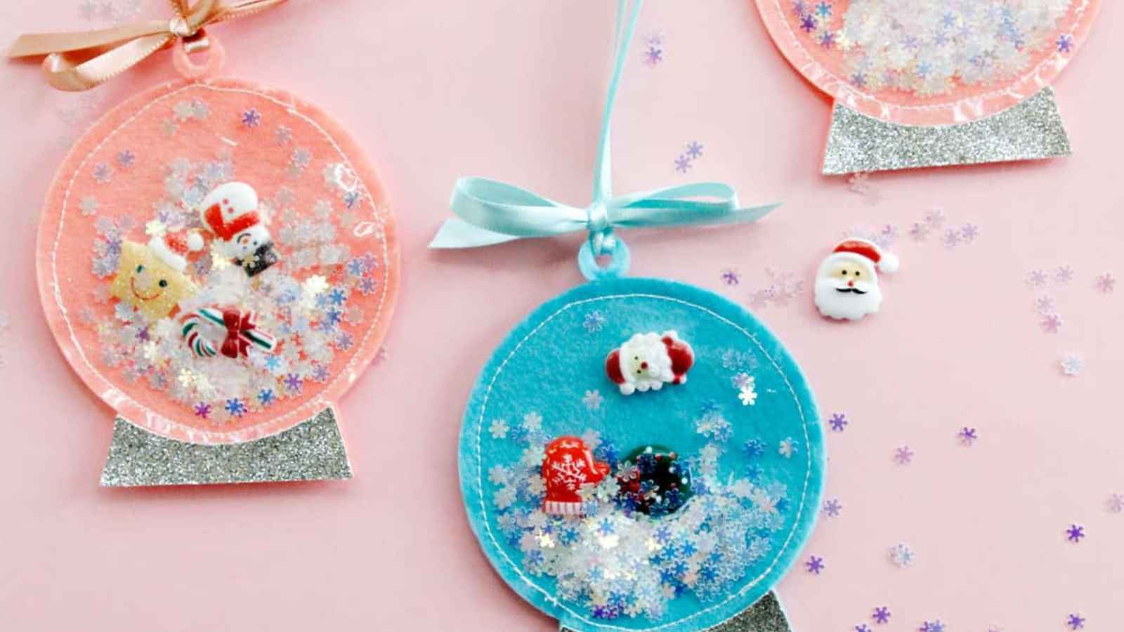 Colorful snow globe ornaments with decorations