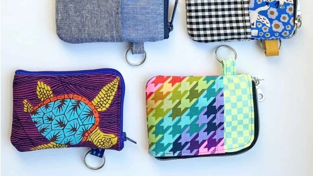Colorful zippered wallets in various designs